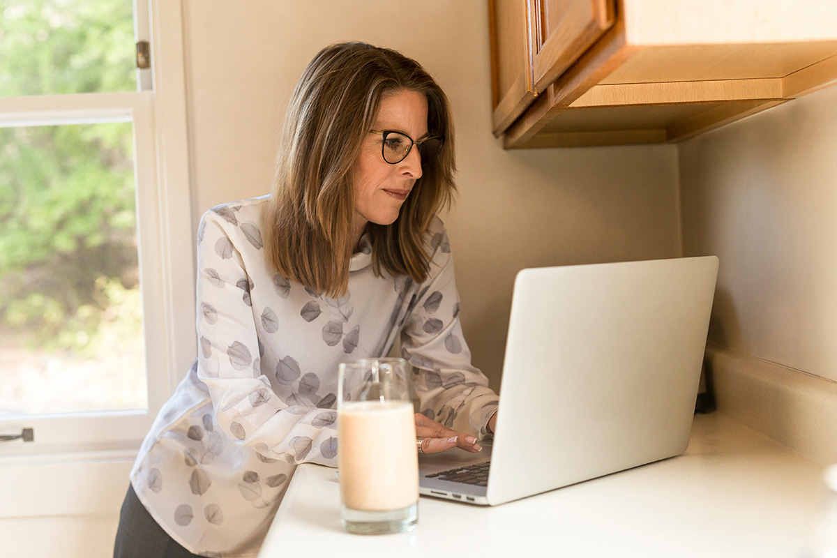 Unified Communications Industry Trends: Work from Home Unified Communications Industry Trends: a Woman by the Laptop is Working from Home